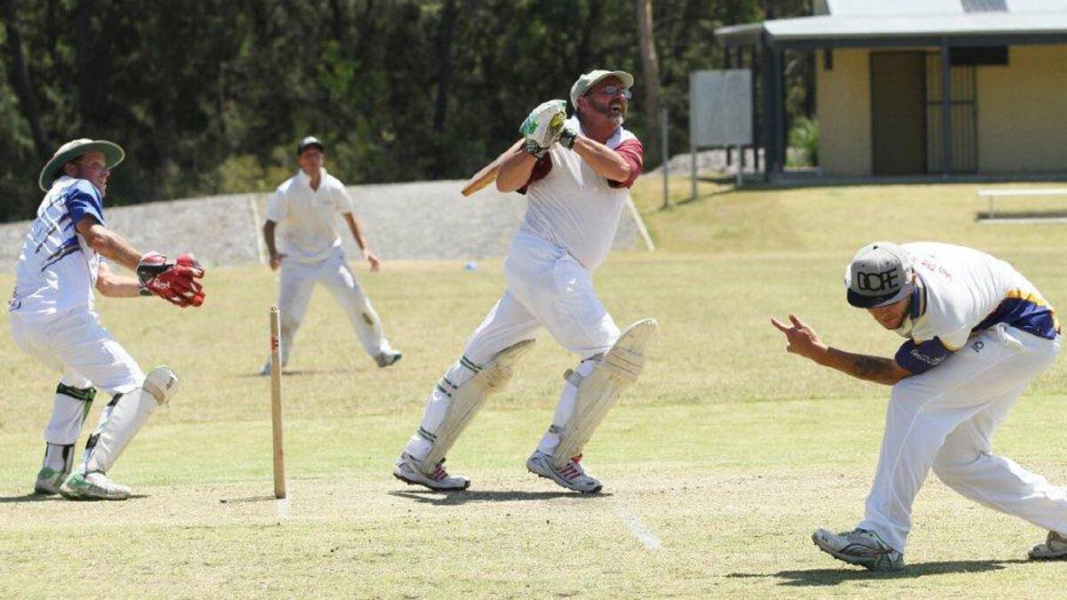 SKY HIGH: North Nowra-Cambewarra’s Brett Mark finds his mark against Ulladulla United in second grade whle Jed Silver (right) ducks for cover.  	Photo: PAUL DAVIDSON