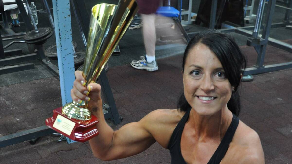 IRON WOMAN: Tracy Murray shows off her newest trophy won at the International Natural Bodybuilding Association Sydney Championships.