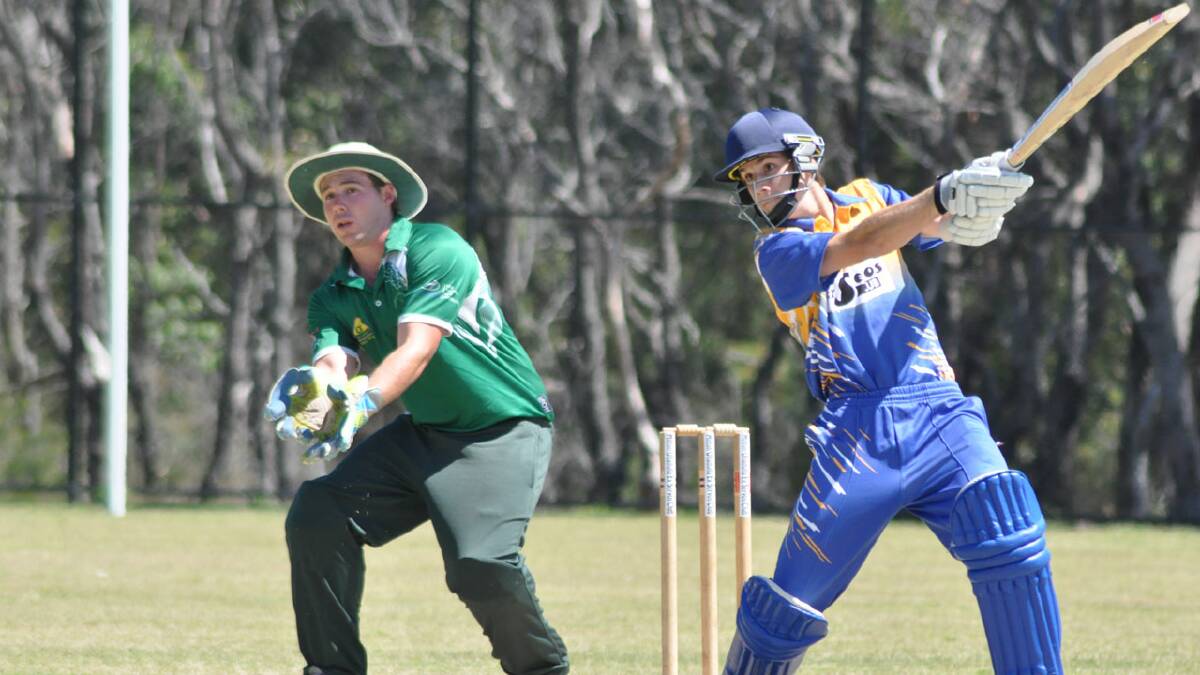 FETCH THIS: Ulladulla’s Peter King takes the attack during his innings against Nowra as wicketkeeper Kurt Quinlan watches on.  Photo: PATRICK FAHY 