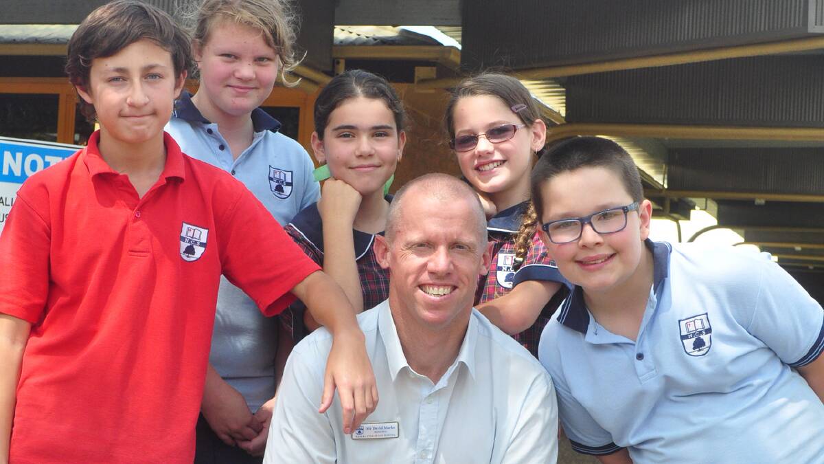 EXCITING TIMES: New Nowra Christian School principal David Marks with students Jamieson Maulguet, Jessica Kibble, Hannah Fakhoury, Elizabeth Yusuf and Sam Davey.