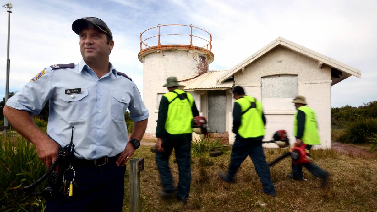 RAPID RESPONSE: Corrective Services trade overseer Robert Duff from the South Coast Correctional Centre with a team of inmates who had been cleaning up Crookhaven headland last year.