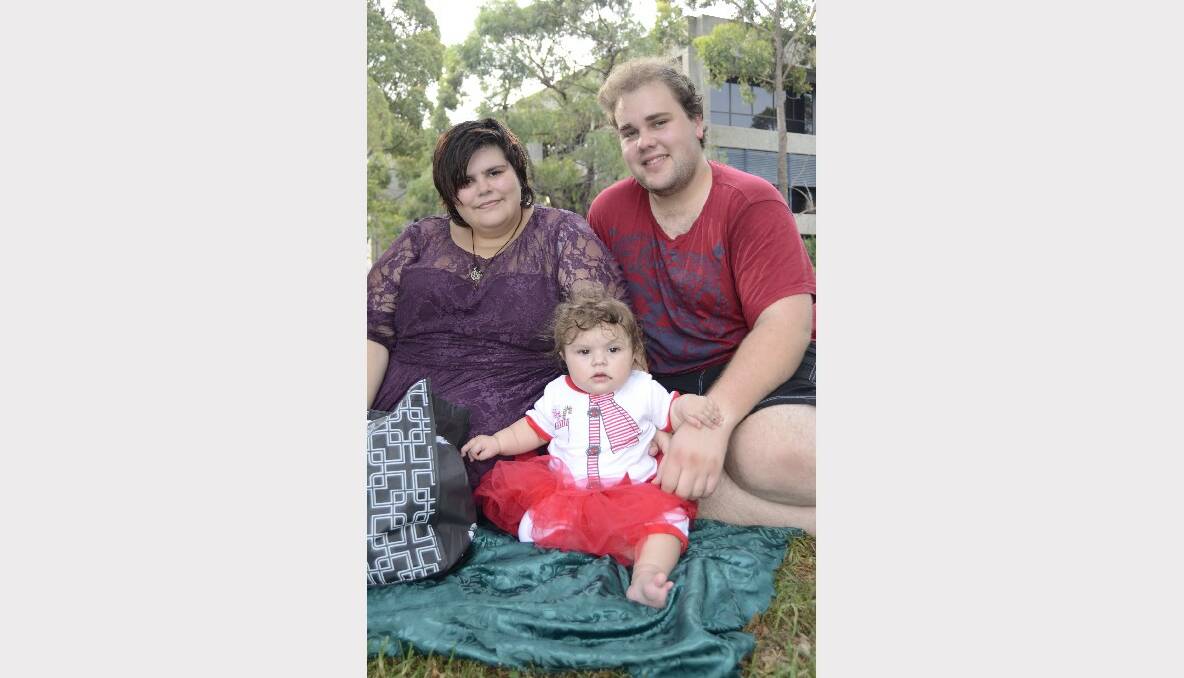 CAROLS BY CANDLELIGHT: At Carols by Candlelight in Harry Sawkins Park on Sunday, Chrissy, Lily-Grace and Richard Carpenter from Worrigee