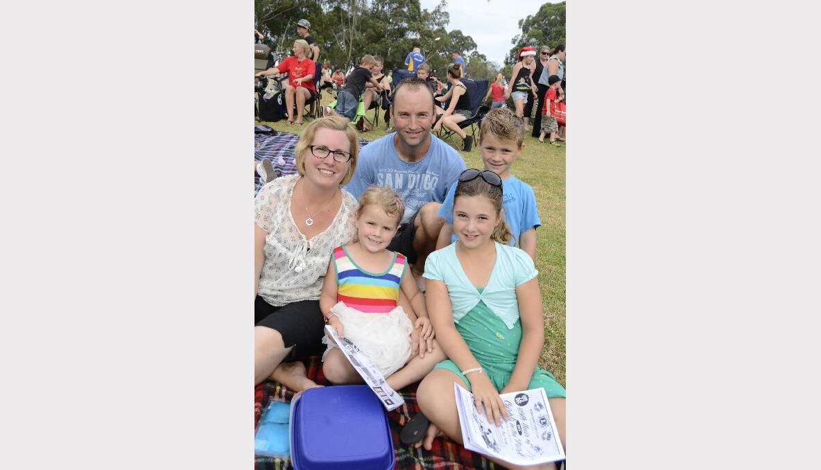 FAMILY: Nicole, Dion, Piper, Boyd and India Schreiber from Bomaderry have a family night out at the Carols by Candlelight in Harry Sawkins Park on Sunday.