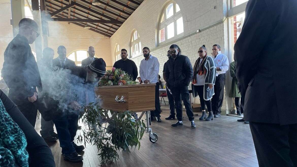 Aunty Colleen Dixon's brother John conducted a smoking ceremony at her funeral on July 15. Photo: Amandine Ahrens