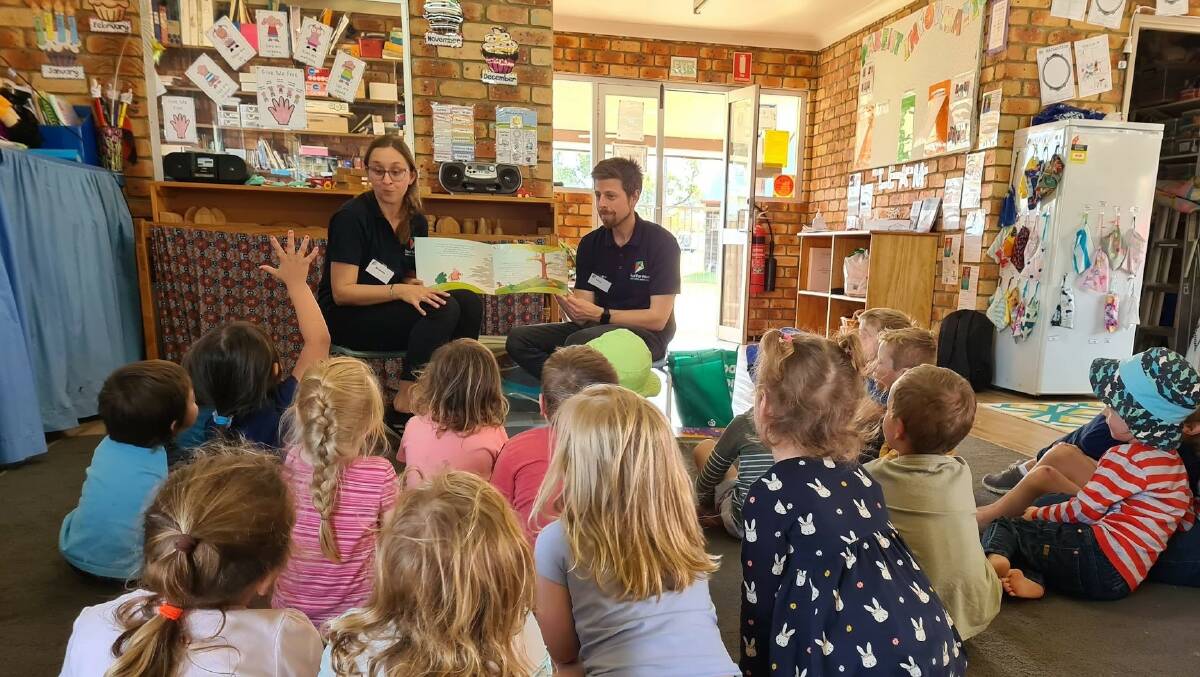 L-R Brianna Williamson (Occupational Therapist) and Chris Anderson (Social Worker) read Birdie and the Fire with a very engaged group of preschoolers. The book is used to initiate conversations with children about bushfire preparedness, response and recovery.