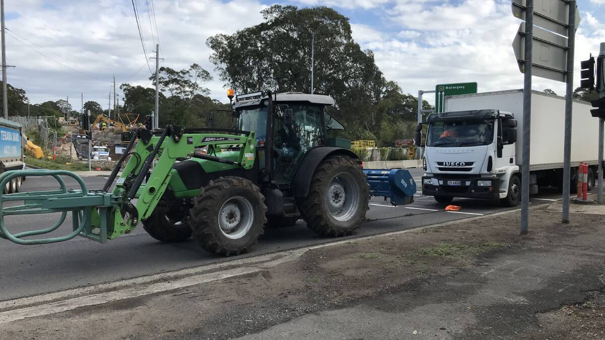 TRAFFIC CHAOS: After hours of blockage, John Bryce towed the broken down truck with his 100 horsepower Deutz tractor across the bridge to a safe location.