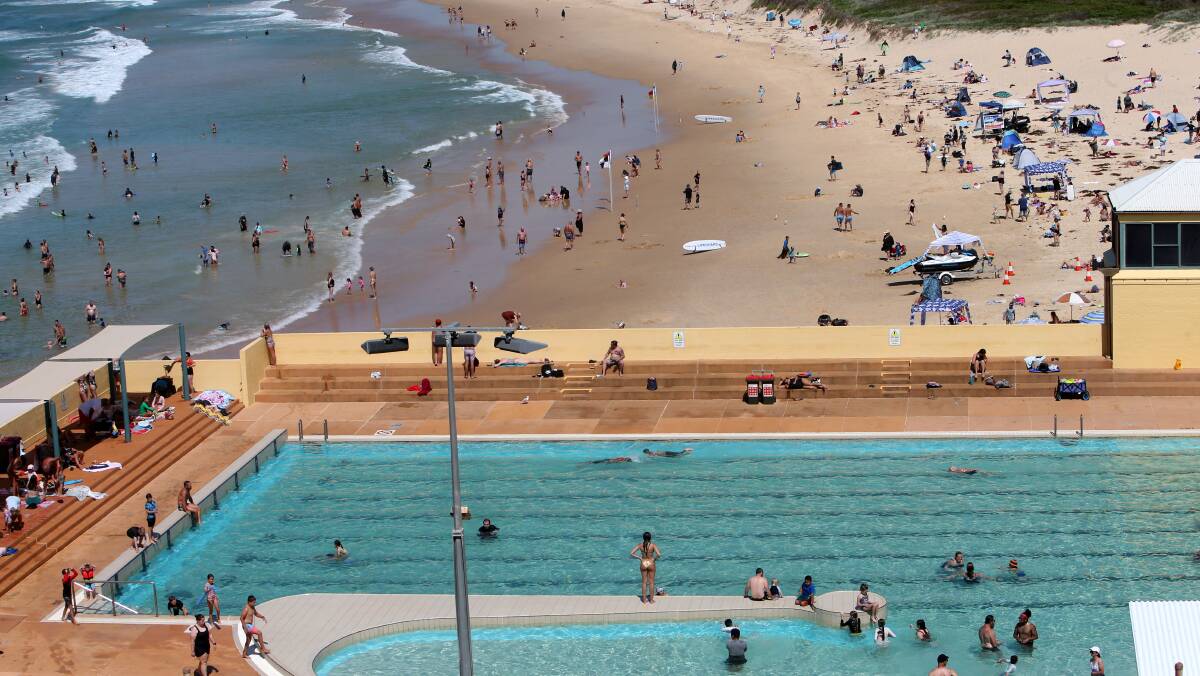 Beach goers at Port Kembla beach during a heatwave in February 2023. Picture by Sylvia Liber