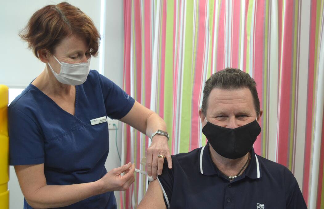 SMILING UNDER THE MASK: Tim Foley said it was a "big relief" to be fully vaccinated. 