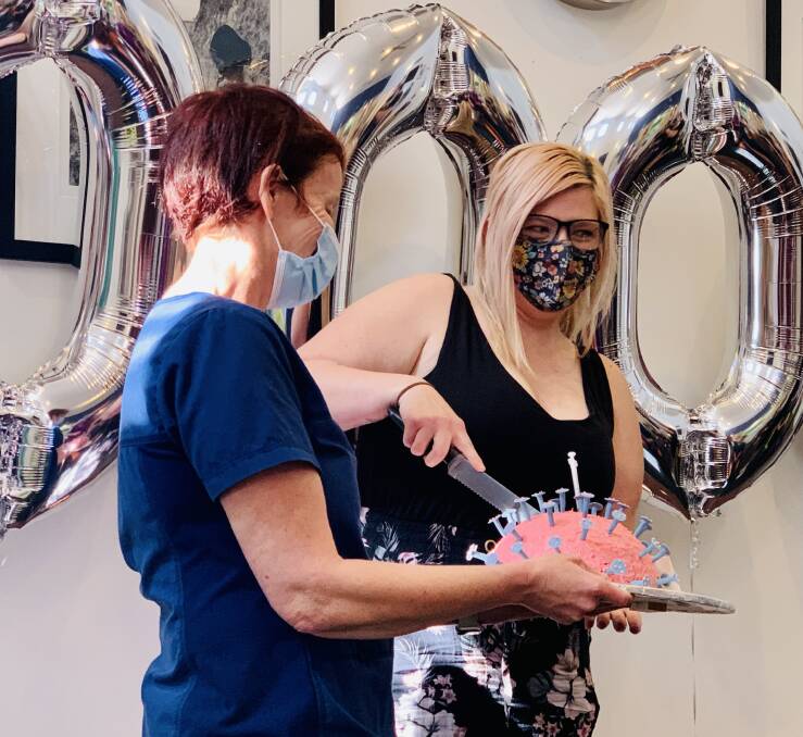 CUTTING THE CAKE: The Shoalhaven Family Medical Centres celebrated with a COVID themed cake and balloons at their Vincentia practice on Saturday. Image: supplied.
