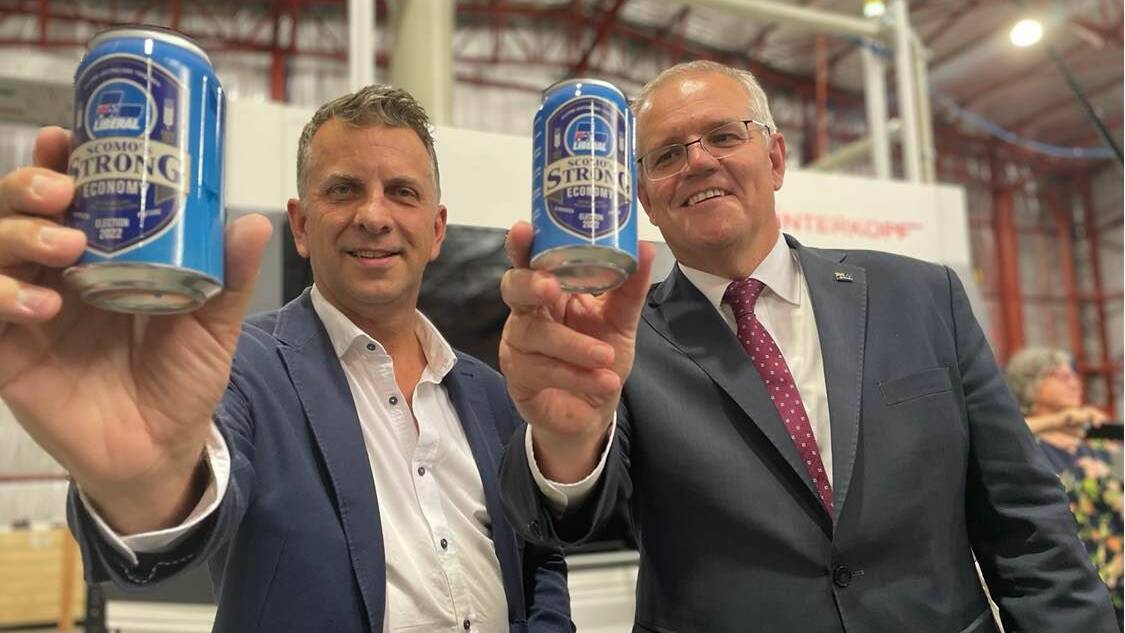 BUSINESS: Prime Minister Scott Morrison and his star candidate Andrew Constance toured Culburra Beach business East Coast Canning, which created a "Scomo's Strong Economy" beer label to mark the occasion. Image: Grace Crivellaro. 