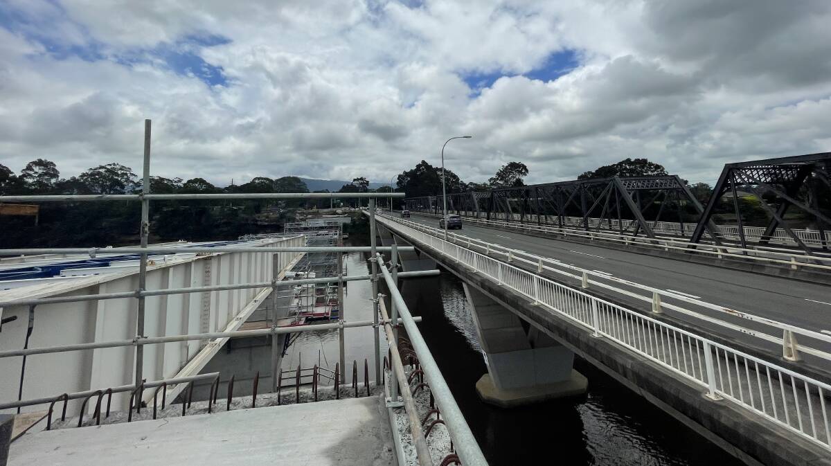 OLD AND NEW: A view of the old bridge from the new Nowra bridge project's halfway point on Thursday, December 9. Image: Grace Crivellaro