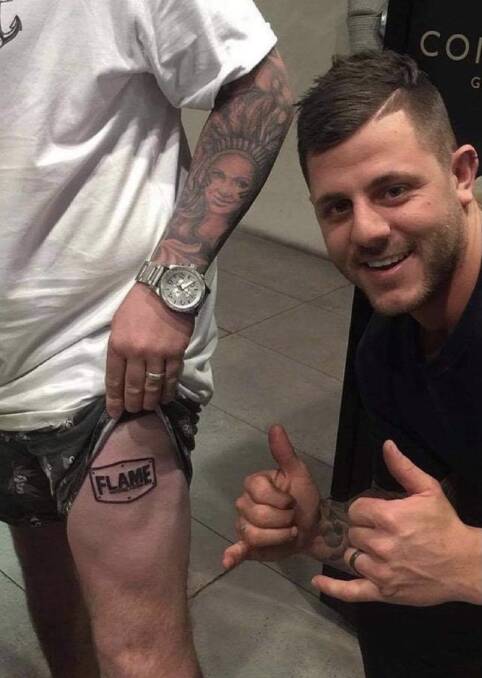 FLAME FAN: Jimmy Hefferan even has the logo for the pizza shop Flame in North Nowra inked on his leg. Image: supplied.