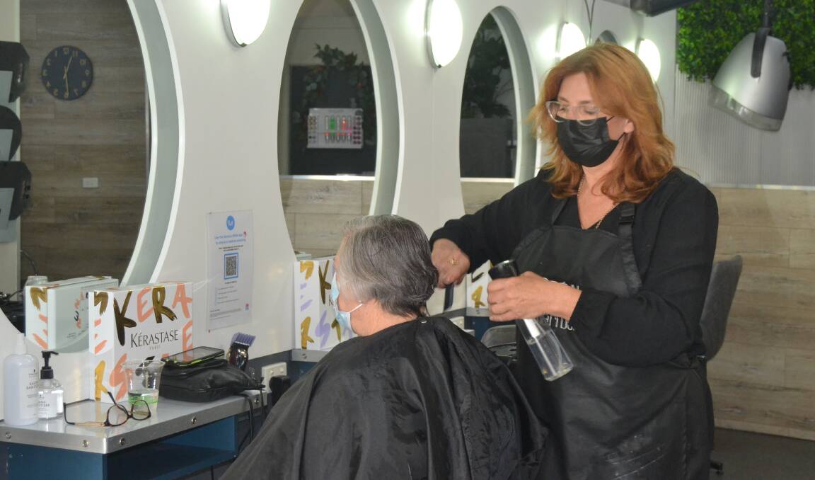 NEW FREEDOMS: As new freedoms were introduced on Monday, the phones at Scruples Hair and Beauty were running hot as residents were desperate for a chop. Image: Grace Crivellaro
