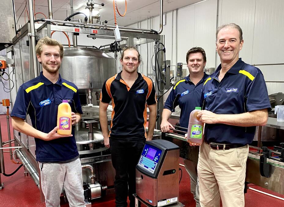 NEW MACHINE: South Coast Juice have purchased a new automated bottling and capping machine, which will turbocharge their output capacity and assist the company in developing new products. L to R: Brighton Hubbert, Ethan Fletcher, director Zak Rush, Bart Leary.