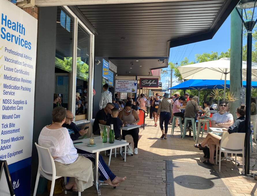 WELCOME BACK: People lined up outside shop fronts and tables were full at cafés in Huskisson over the weekend, Saturday, November 6.