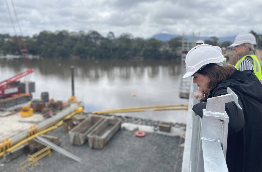 HIVE OF ACTIVITY: South Coast MP Shelley Hancock peering over the 3.5 metre walkway of the new Nowra bridge project. Image: Grace Crivellaro.