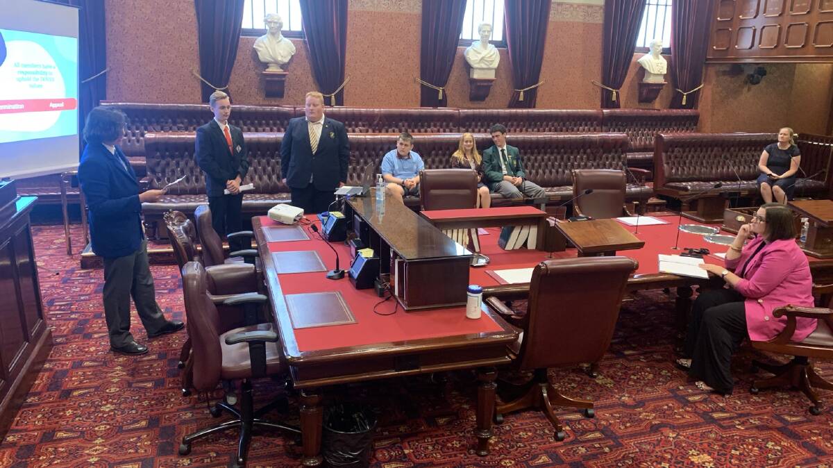 Jay Sutton, fourth from the left, in Parliament last Wednesday with students across the state presenting a proposal to Education Minister Sarah Mitchell.