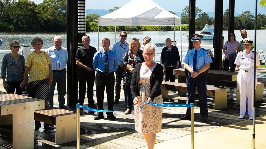  Shoalhaven Mayor Amanda Findley cuts the ribbon, behind from left Margie Jirgens, Judy Denby from Site Specific, Clr John Wells, Paul Jennings, Clr Mark Kitchener, John Visser, Clr Patricia White, Roslyn Holmes, Lynne Allan from Shoalhaven Historical Society, Superintendent Greg Moore, Louise and Sean O'Driscoll and Commander Kerry Rohrsheim. Image: supplied by Shoalhaven City Council.
