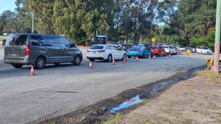 HUSKISSON QUEUE: Around 40 cars were lined up along Kioloa Street in Huskisson at 10:15pm, according to Huskisson Sports Club staff member Andy Rice who took this picture when starting his shift. 