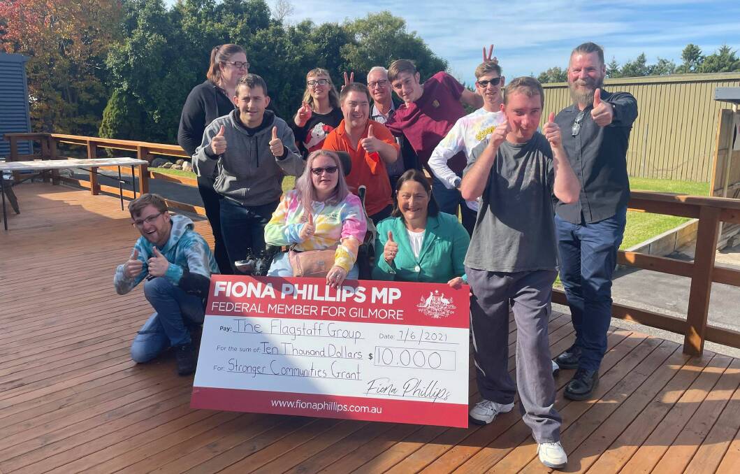 STRONGER COMMUNITIES: Gilmore MP Fiona Phillips congratulated the Flagstaff Group on using the grant towards building shading over their deck.