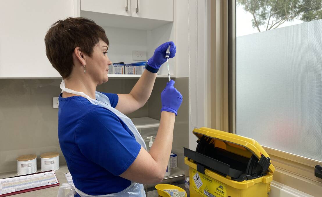 "PERFECTLY SAFE": Vincentia Medical Centre nurse Leanne Phillips preparing a dose of the AstraZeneca vaccine. Image: Grace Crivellaro.