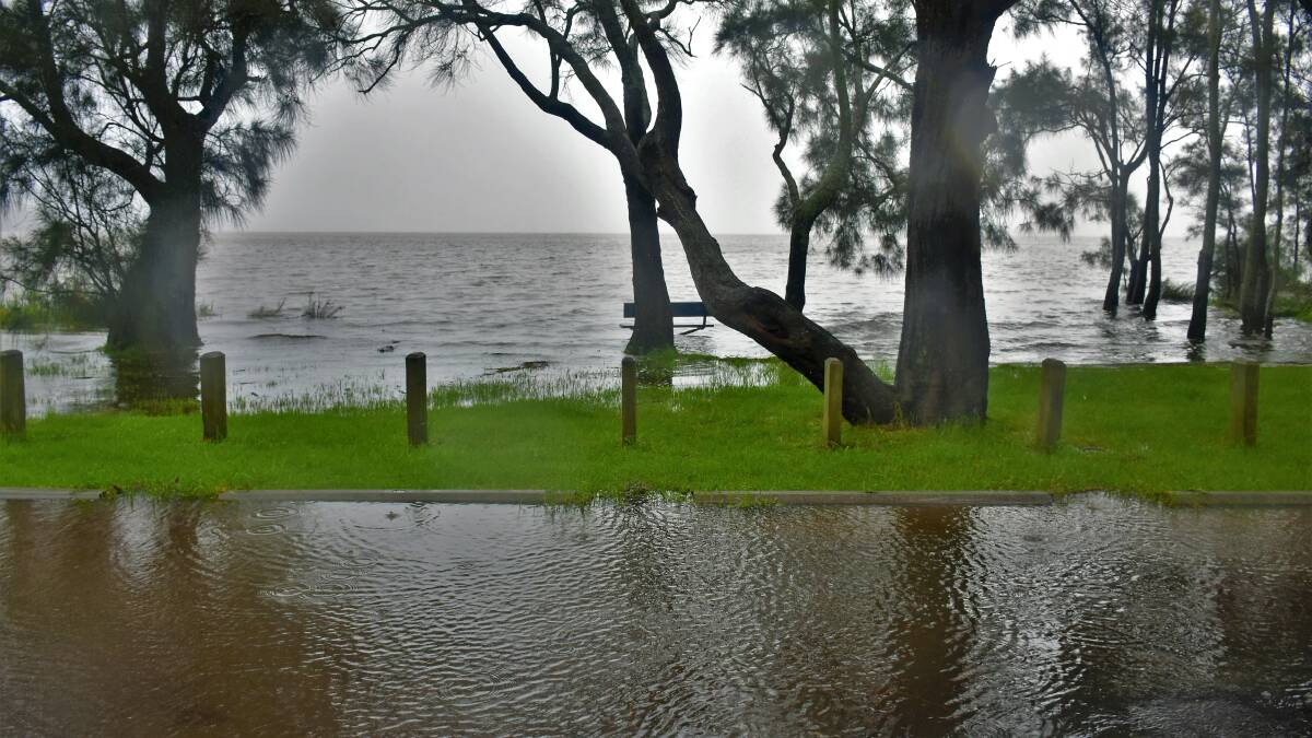 Floodwaters spilling at St Georges Basin, Thursday March 3. Image: Dannielle and Matt Connolly Photography.