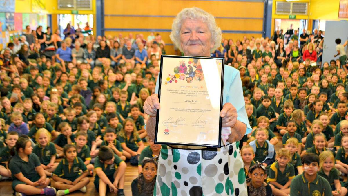 VALE VIOLET: Violet Lord when she received her NSW Grandparent of the Year Recognition Certificate at a special Nowra East Public School assembly in 2015. File image.