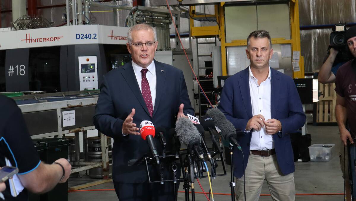 ROAD FUNDS: Prime Minister Scott Morrison and Liberal Gilmore candidate Andrew Constance in Culburra Beach on Monday where a $40 million pledge was made to fix the Shoalhaven road network. Image: Jorja McDonnell.