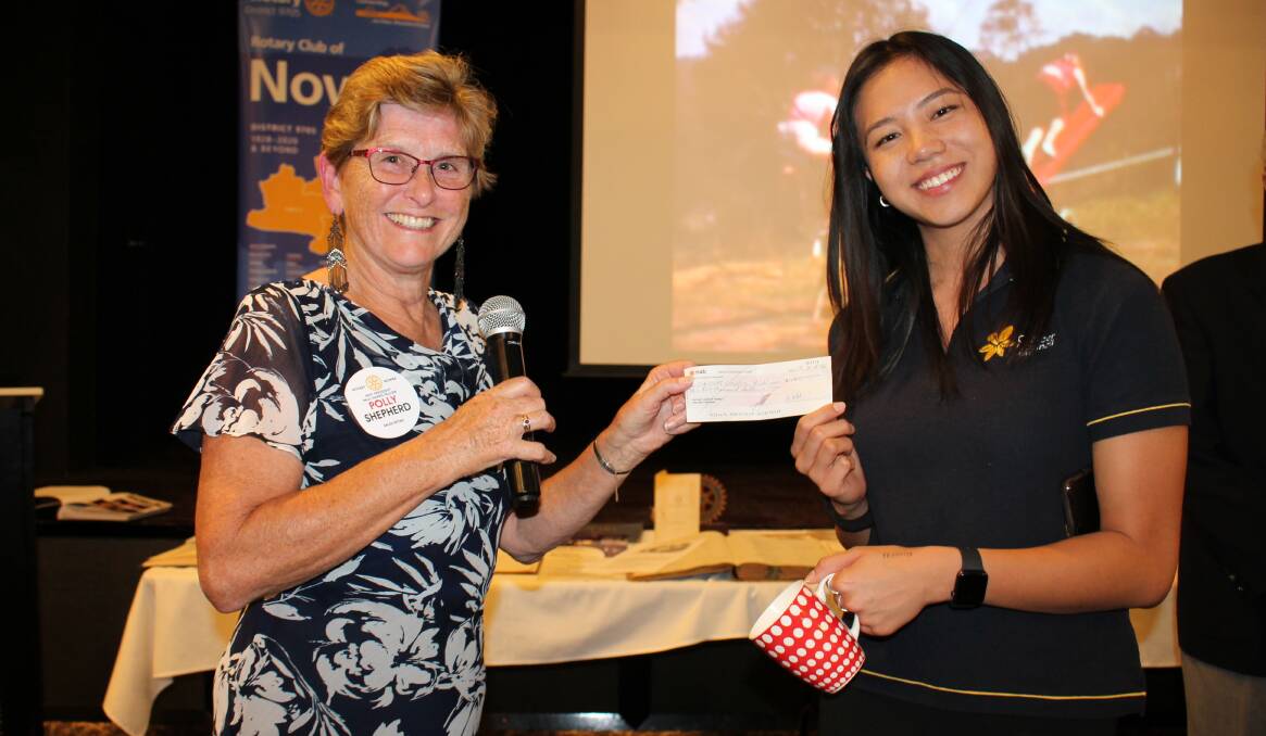 FOR A GOOD CAUSE: Biggest Morning Tea coordinator Rotarian, Polly Shepherd hands over a $1,000 cheque to Vanessa Ng, the Community Operations Administrator for NSW Cancer Council.