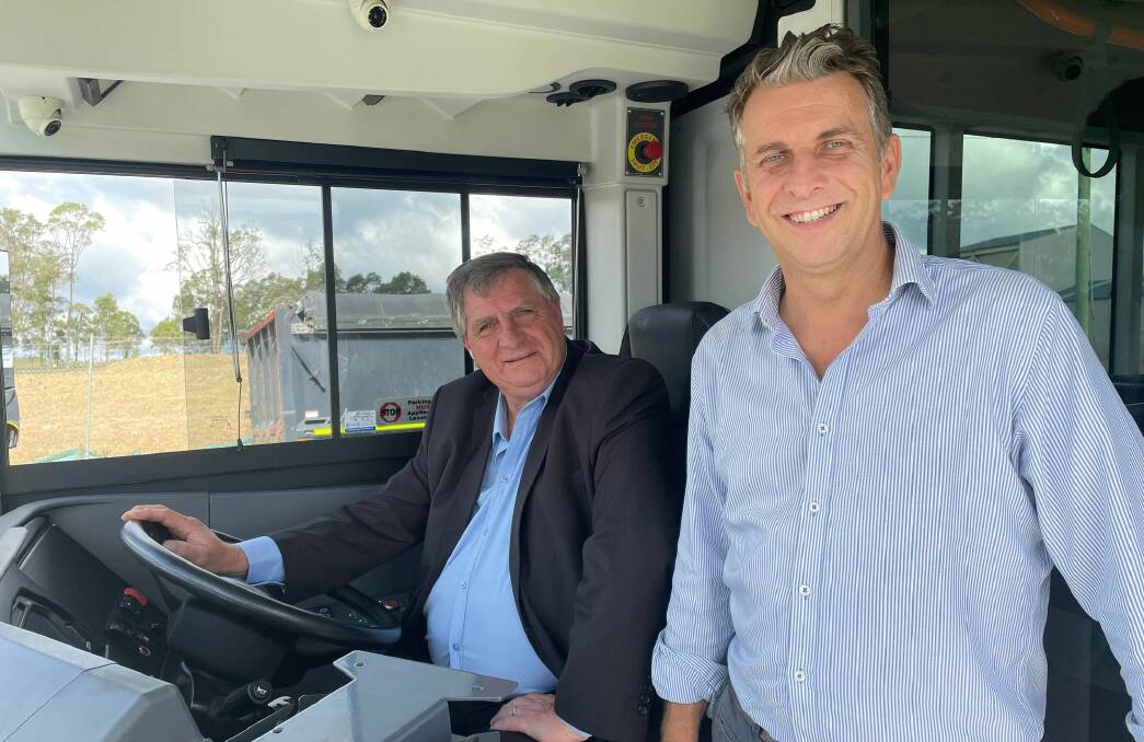 E-BUS: Gerard King of Illawarra Premier Transport and Gilmore Liberal candidate Andrew Constance took Custom Denning's e-bus for a spin on Tuesday. Image: Grace Crivellaro.