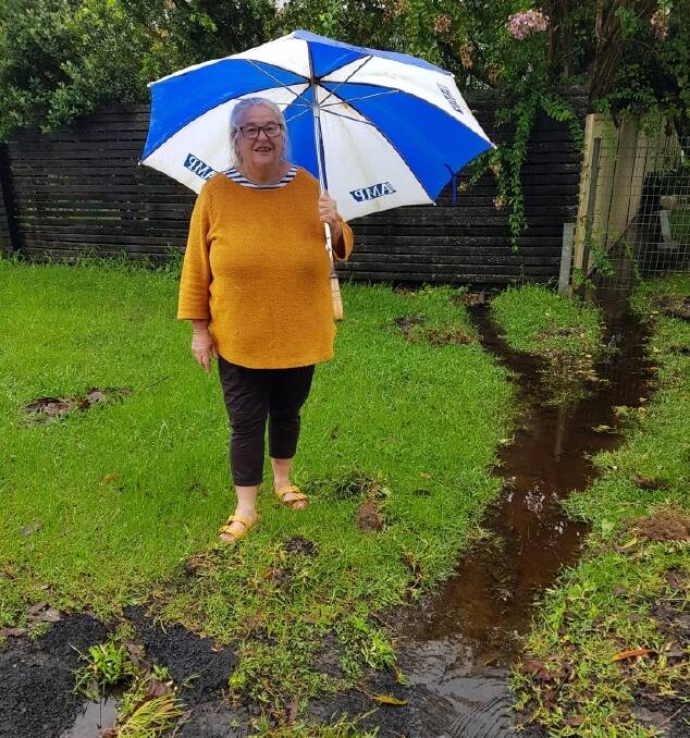 FLOOD WATCH: Maureen Noonan of Woollamia has been doing extra drainage to protect her property. Image: supplied.
