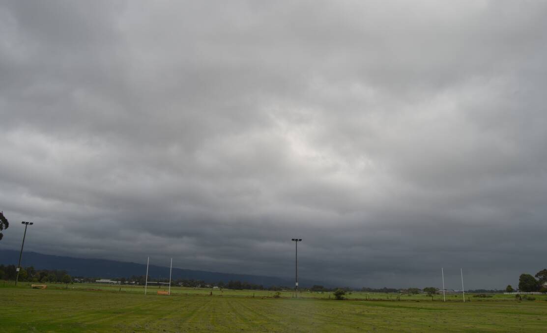 DAMAGING WINDS: Grey clouds over Lyrebird Sports Park in Nowra at 12pm Friday, December 10. Image: Grace Crivellaro.