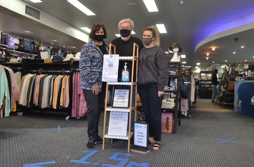 MISSING DAY TRIPPERS: Owners of Aquatique Annie and Arnold Aldous with their daughter Sarah Aldous in their Nowra store. 