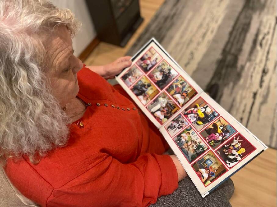Sandra flicks through an album of memories with their daughter Jackie, who sadly passed away last year. 