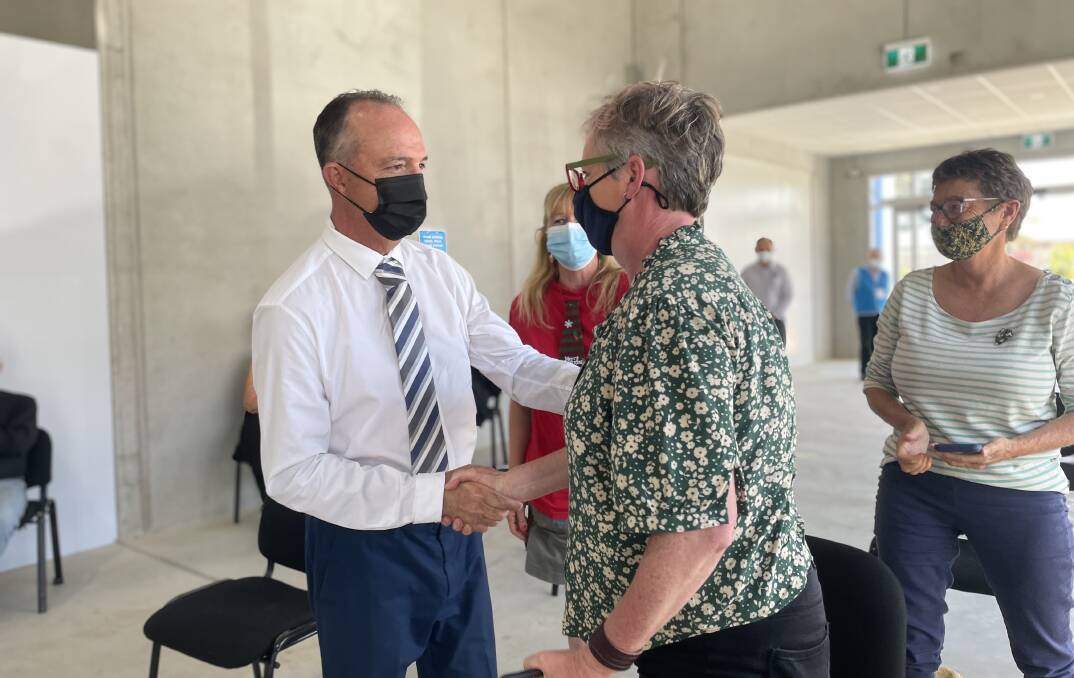 Lead challenger Paul Green congratulated returning mayor Amanda Findley after the results were announced by the NSW Electoral Commission officer on Monday, December 20. Image: Grace Crivellaro.