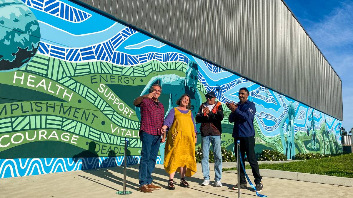 'COMING TOGETHER': The huge 160 square metre mural celebrates connection through sport, and took artist Warwick Keen eight months to design. 