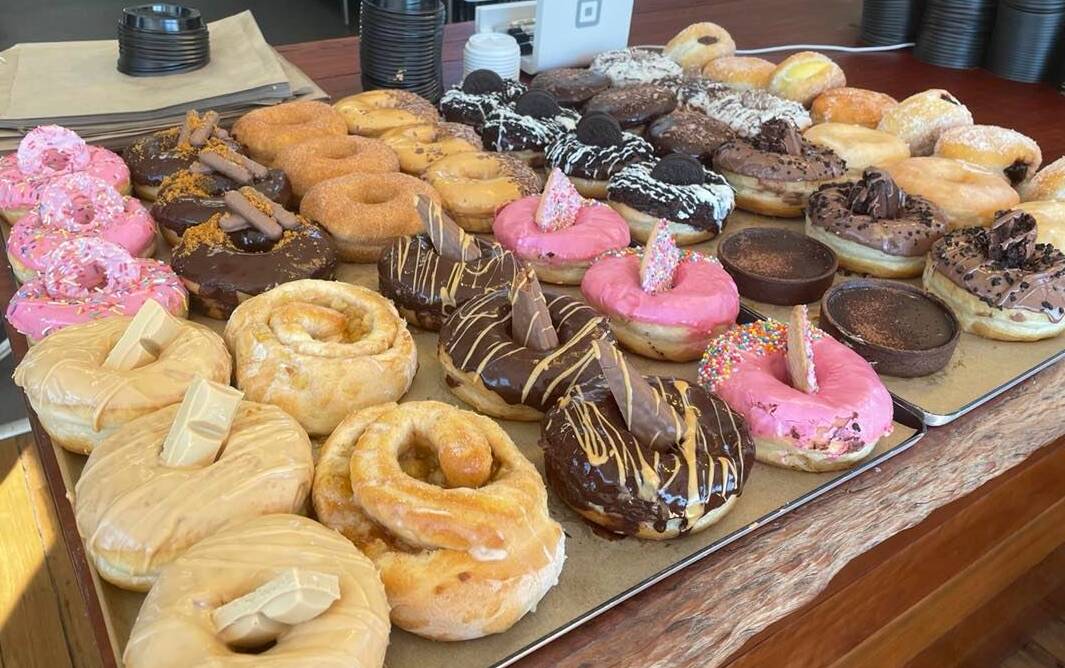 SWEET TREATS: From the classic cinnamon, to a loaded caramilk creation, and even a pink Simpsons-inspired design - Espresso Boys creations have drawn in crowds for the past two months at their new Nowra store. Image: Grace Crivellaro.