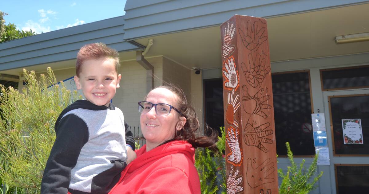 BONDING THROUGH ART: Bree Carpenter, who attended Lyrebird Preschool in Nowra 26 years ago, said it was always a dream to enrol her son Connor there. Now, his hand print is at the top of the post at the preschool's entry. Image: Grace Crivellaro.