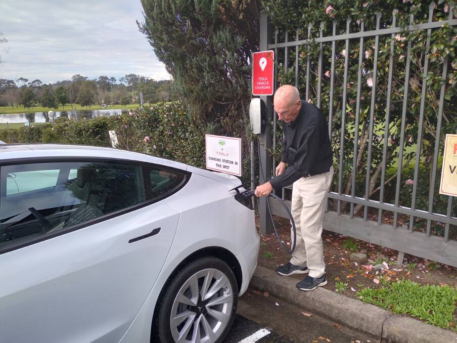 SHASA member Mike MacNamara recharges his EV at the Moruya Golf Club EV charger. Photo: Supplied.

