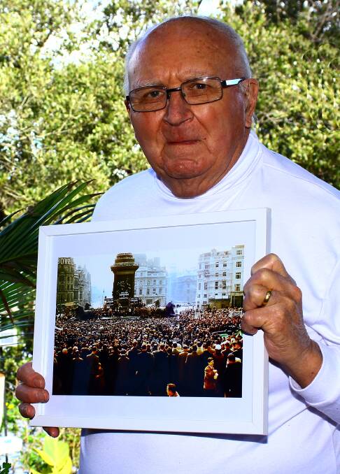 Batemans Bay photographer Ted Richards holds his photograph of the Aldermaston Marches that will be on permanent display in the Museum of London.