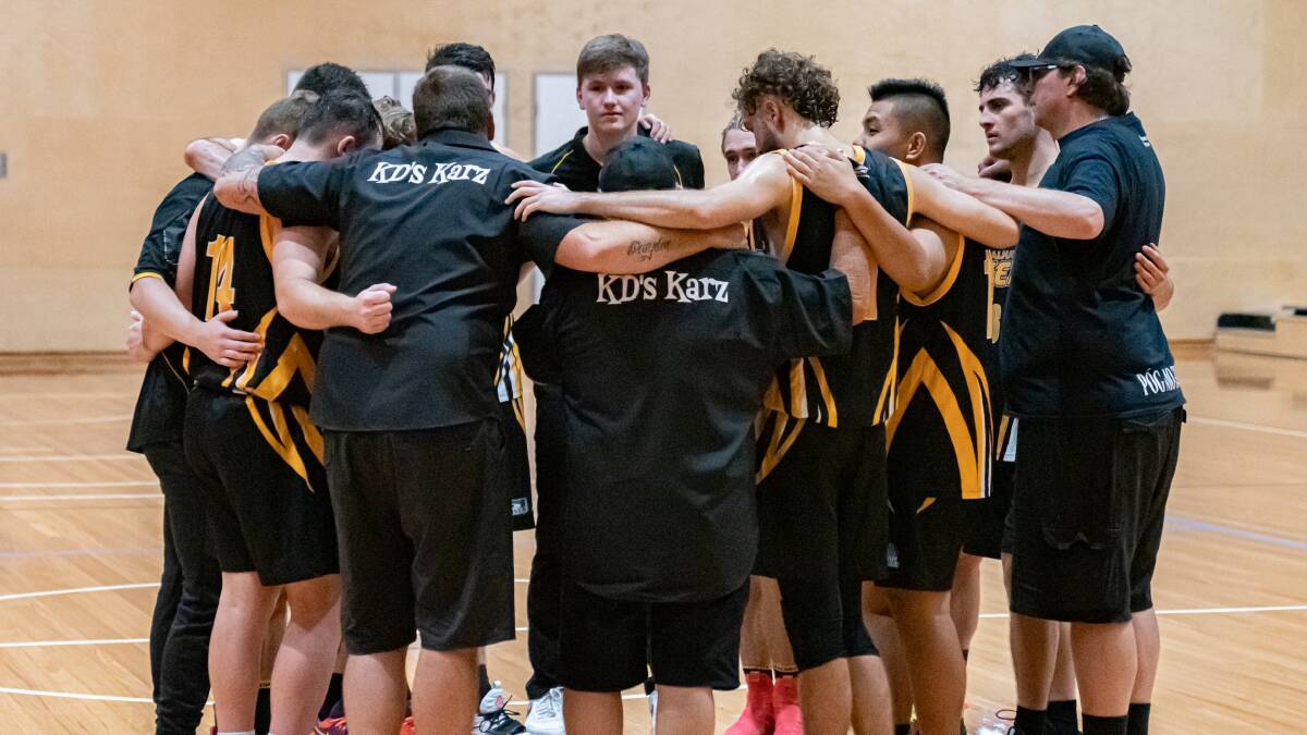 BOUNCE BACK STRONG: The Tigers huddle prior to their opening round win. Picture Shoalhaven Basketball. 