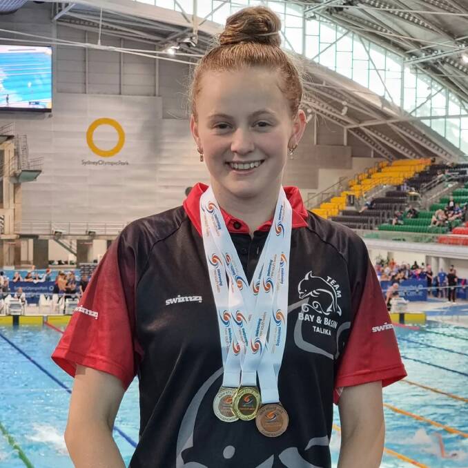 Talika Irvine pictured with her medals. Supplied picture 