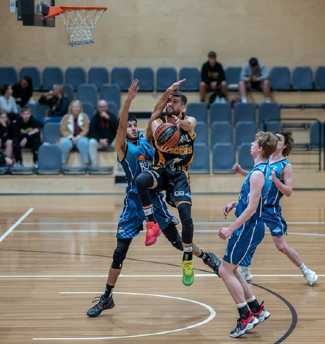 Bomaderry Tigers' Jack Callaghan going for a layup against the Goulburn Bears. Picture by Shoalhaven Basketball Association. 