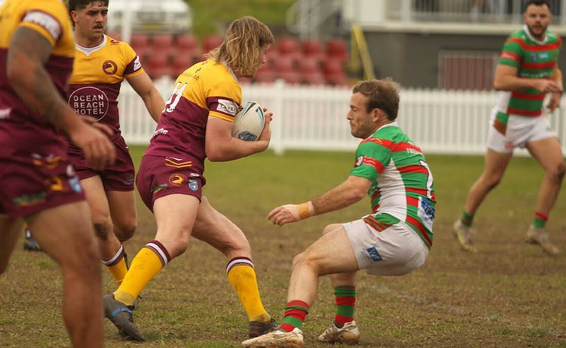 SUPERB WIN: Jamberoo captain-coach Jono Dallas about to halt the progress of Shellharbour Sharks second-rower Hudson Spicer during the Superoos resounding 48-4 win on Sunday. Picture: DAVID HALL.