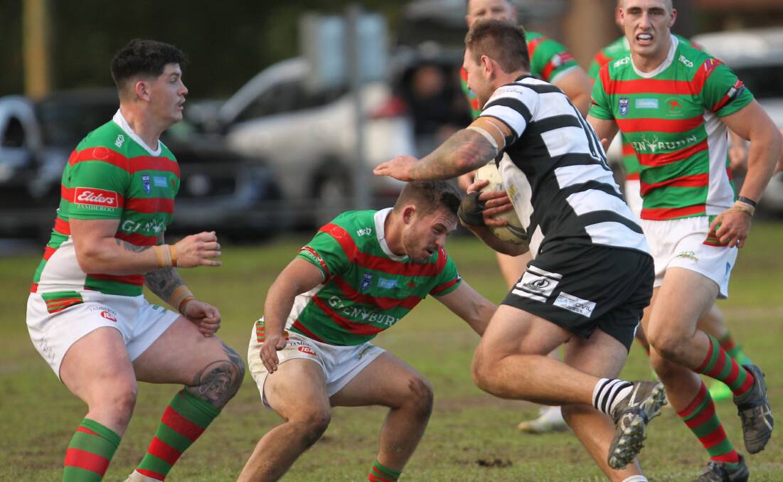 HOME DEBUT SPOILED: Magpies front rower Lloyd Thomas takes on the Jamberoo defence as Superoos hooker Cameron Brabender steadies himself to make the tackle. Picture: David Hall.