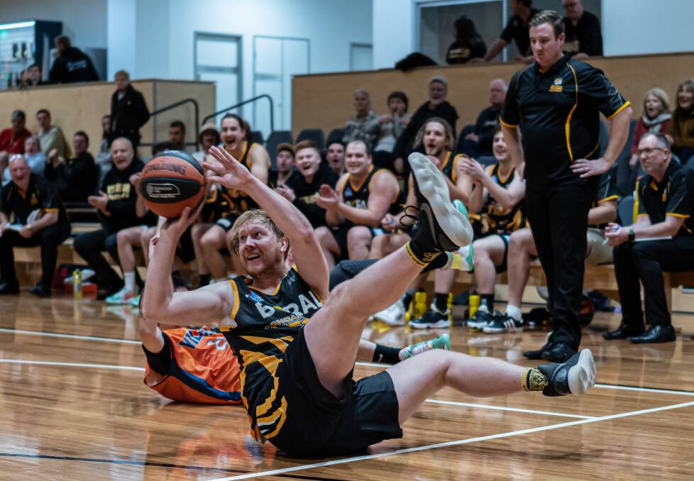 GAME-CHANGER: #13 Dane Jensen diving for a loose ball as part of his fantastic outing for the Tigers. Picture: Shoalhaven Basketball Association. 