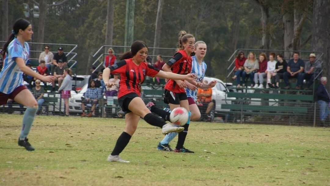 KICKING GOALS: Shoalhaven United's Dianna Crossley Bloxsome (Centre) mid-kick. Picture: Supplied. 