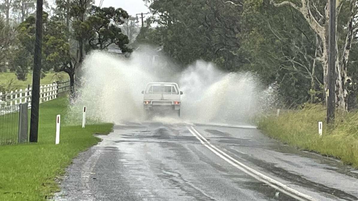 ROAD CLOSURES: Water over the road at Worrigee in the Shoalhaven on Wednesday. Picture: Supplied