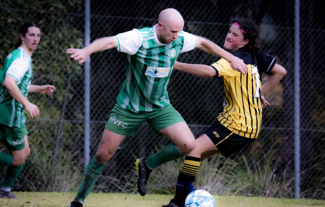 HUSTLE: Huskisson's Gary Masterson and Bomaderry's Tully Dennis fighting for possession. Picture: Team Shot Studios.