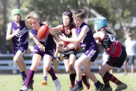 The U11 Ulladulla Dockers and Bay & Basin Bombers clashing in the finals. Picture by Team Shot Studios.